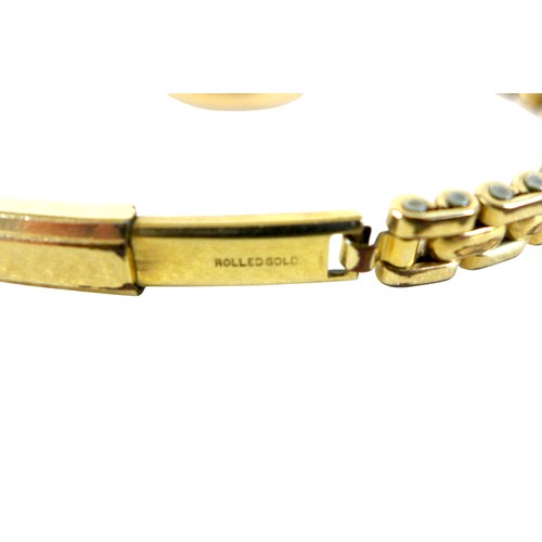 29 - A 9ct gold pair of earrings, 2g, together with a 9ct gold cased lady's cocktail watch with rolled go... 
