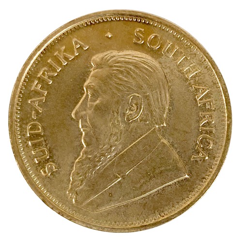 105 - A 22ct gold South African Krugerrand, 1974, 'Fyngoud 1oz Fine Gold', 32.5mm, 33.8g, in burgundy colo... 