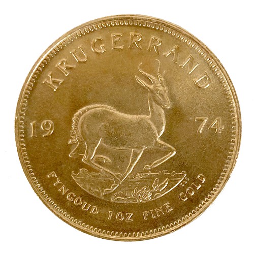 105 - A 22ct gold South African Krugerrand, 1974, 'Fyngoud 1oz Fine Gold', 32.5mm, 33.8g, in burgundy colo... 
