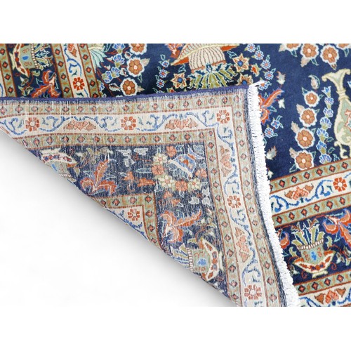 354 - A hand knotted Meshed rug, with blue ground and caucasian borders, 316 by 191cm.