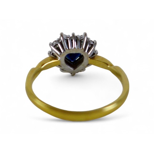 49 - A 9ct yellow gold, sapphire and diamond ring, set with heart shaped dark blue sapphire, 6 by 6 by 3m... 