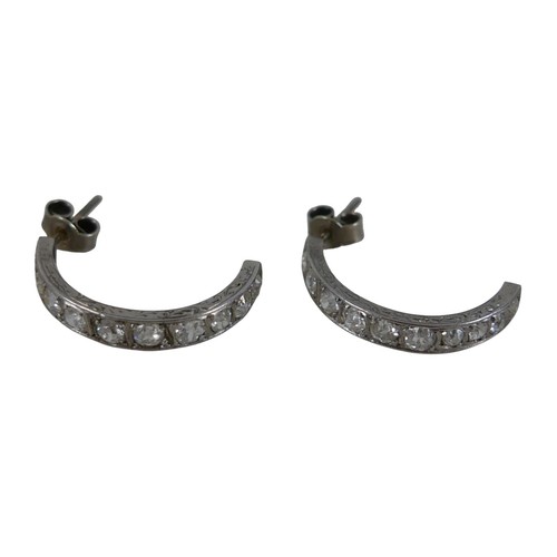 47A - A pair of diamond half hoop platinum earrings, made from a full eternity ring, each round cut stone ... 