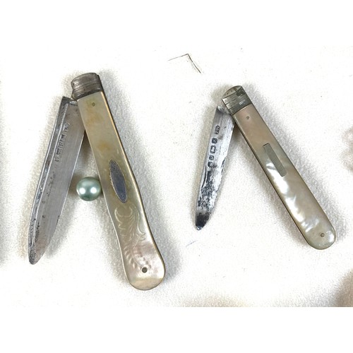 26 - A group of silver and costume jewellery, including a silver backed hand mirror, two Victorian silver... 