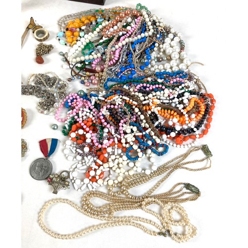 26 - A group of silver and costume jewellery, including a silver backed hand mirror, two Victorian silver... 