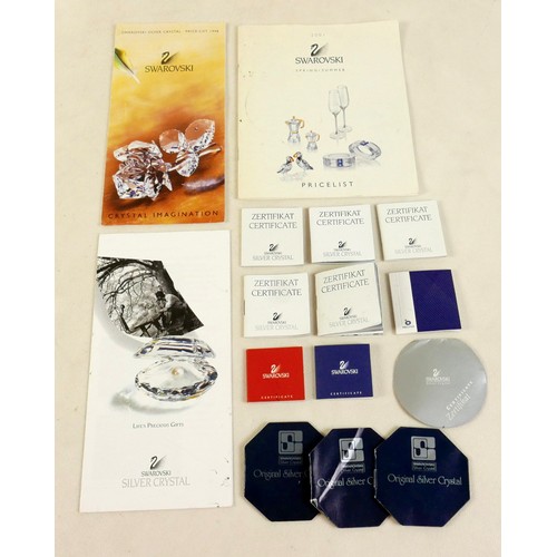 264 - A group of Swarovski crystal ornaments, including kiwi, owl, snail and large swan, with boxes and va... 