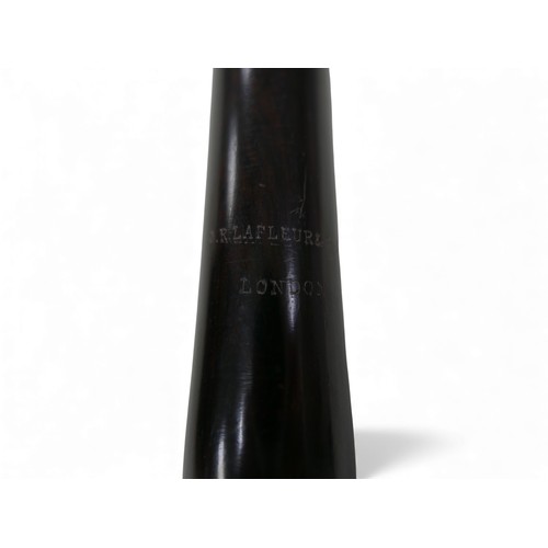 54 - An early 20th century ebony flute, by J. R. Lafleur & Sons, London, with hard fitted case.