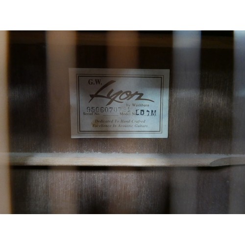 40 - A Washburn G. W. Lyon LD 7M, six string acoustic guitar.