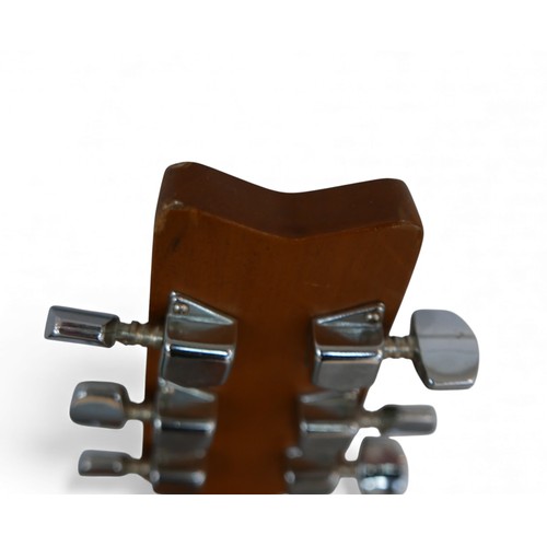 40 - A Washburn G. W. Lyon LD 7M, six string acoustic guitar.