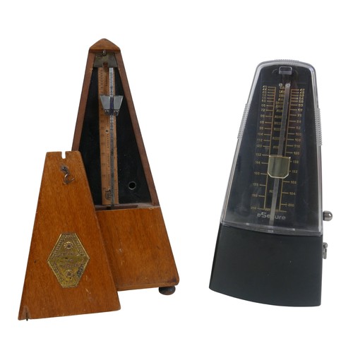 50 - An Embassy Beason clarinet and two metronomes.(3)
