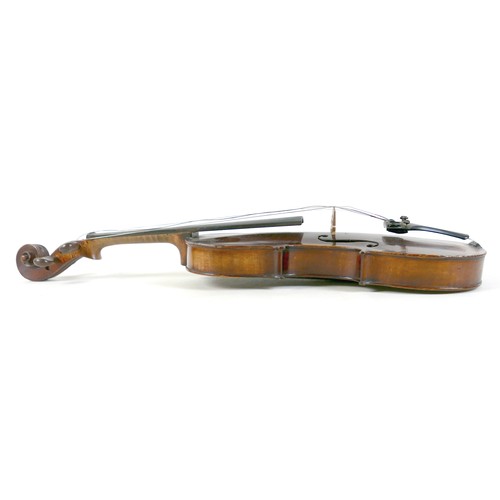 21 - An early / mid 20th century Continental violin, with an indistinct label, 14 inch two piece back. 
P... 