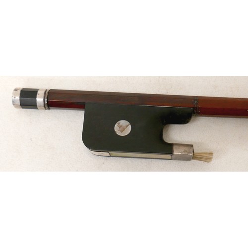 27 - A violin bow, with ebonised and mother of pearl inlaid frog, 60g, 66cm long.