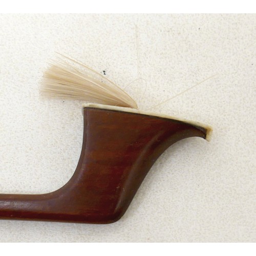 27 - A violin bow, with ebonised and mother of pearl inlaid frog, 60g, 66cm long.