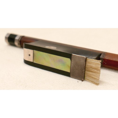 27 - A violin bow, with ebonised and mother of pearl inlaid frog, 60g, 66cm long.