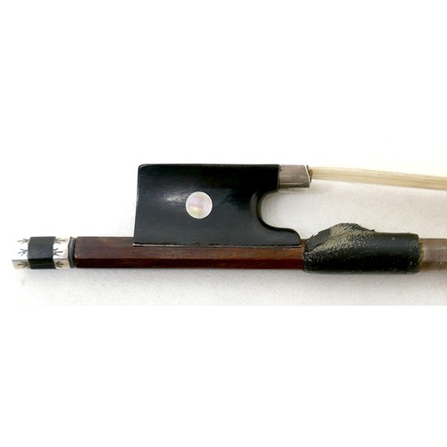 34 - A violin bow with engraved frog and ferrule, 60g, 73cm long.