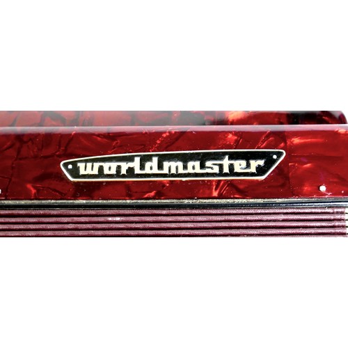 63 - A World Master accordion, red marbled finish, in carry case.