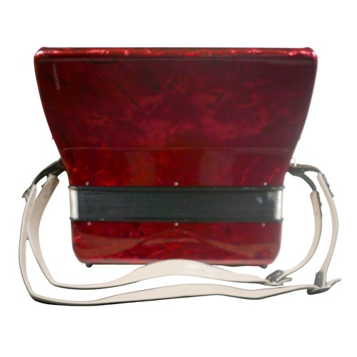 62 - A Hohner accordion, in red marbled finish.