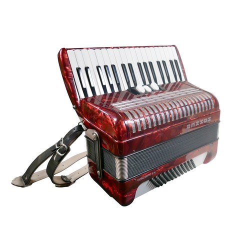 62 - A Hohner accordion, in red marbled finish.
