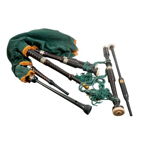 64 - A set of bagpipes, with green fabric and ebonised pipes, inscribed maker's name 'Inveran' to one pip... 