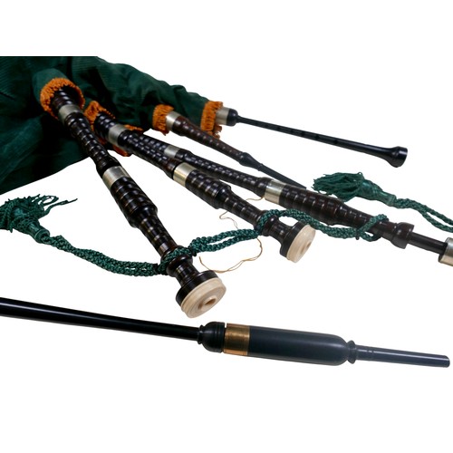 64 - A set of bagpipes, with green fabric and ebonised pipes, inscribed maker's name 'Inveran' to one pip... 