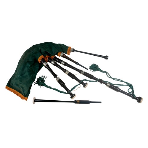 64 - A set of bagpipes, with green fabric and ebonised pipes, inscribed maker's name 'Inveran' to one pip... 