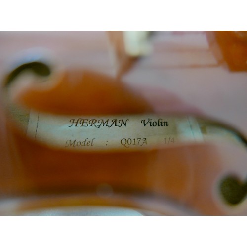 23 - A late 20th century German 1/4 size violin, by Herman, model Q017A, with bow and soft case, back 11