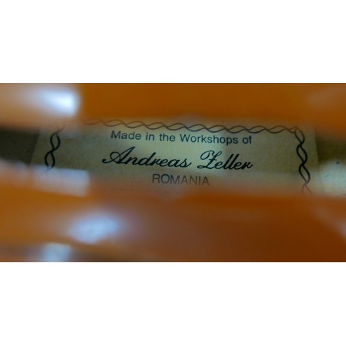 22 - A late 20th century Romanian violin, by Andreas Feller, with two bows and in a black fitted hard cas... 