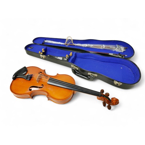 22 - A late 20th century Romanian violin, by Andreas Feller, with two bows and in a black fitted hard cas... 