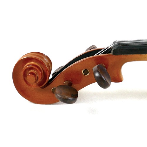 22 - A late 20th century Romanian violin, by Andreas Feller, with two bows and in a black fitted hard cas... 