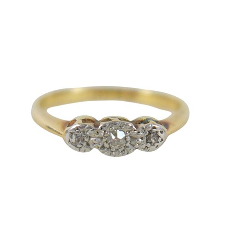 32 - An 18ct yellow gold and platinum three stone diamond ring, illusion set, size K, 2.2g.