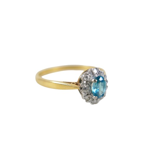 53 - An 18ct yellow gold pale sapphire and diamond cluster ring size W, head size 10 by 8mm, 4.0g.