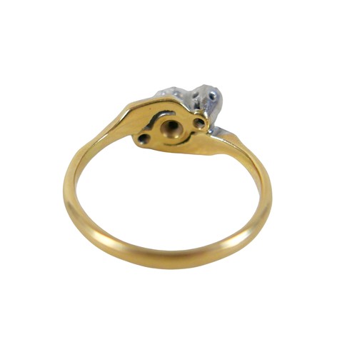 45 - An 18ct yellow gold and platinum three stone diamond crossover ring, illusion set, size N, 3.4g.