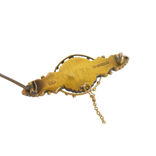 33 - A 9ct yellow gold brooch set with a small seed pearl, having a steel pin, 4.5cm wide, 3.8g.