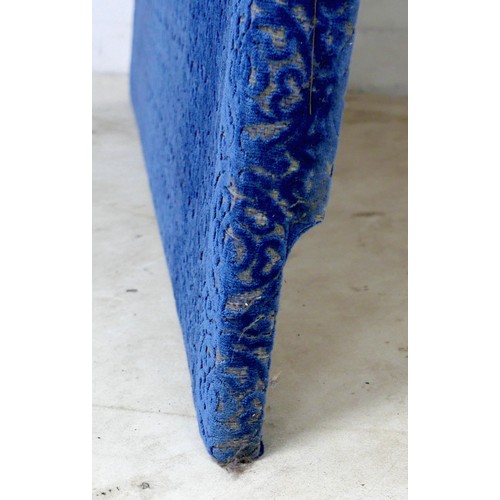 367 - An oversized double headboard, upholstered in blue jacquard fabric, with conforming wooden baton (Fr... 