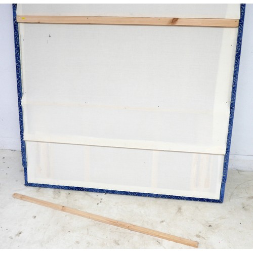 367 - An oversized double headboard, upholstered in blue jacquard fabric, with conforming wooden baton (Fr... 
