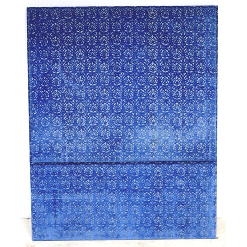 367 - An oversized double headboard, upholstered in blue jacquard fabric, with conforming wooden baton (Fr... 