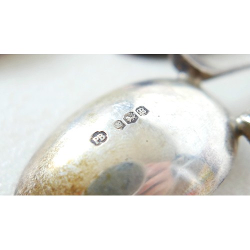 34 - Eighteen assorted silver golf novelty teaspoons, comprising 4 with cross clubs maker PB Sheffield 19... 