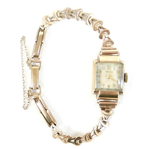 59 - A 9ct gold cased lady's Oriosa wristwatch, with gold strap, square dial, 14.1g.