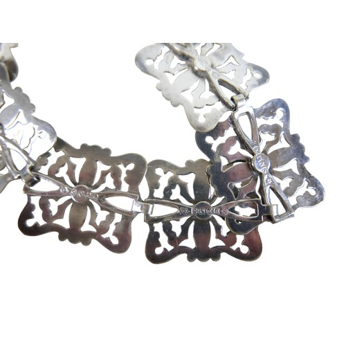 8 - A silver plated nurses belt buckle decorated with a hunt scene, a silver plated belt, 67cm long, a L... 