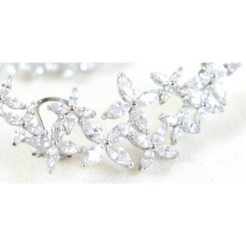 41 - A pair of silver Swarovski star burst Christmas party earrings, 54 by 22mm.