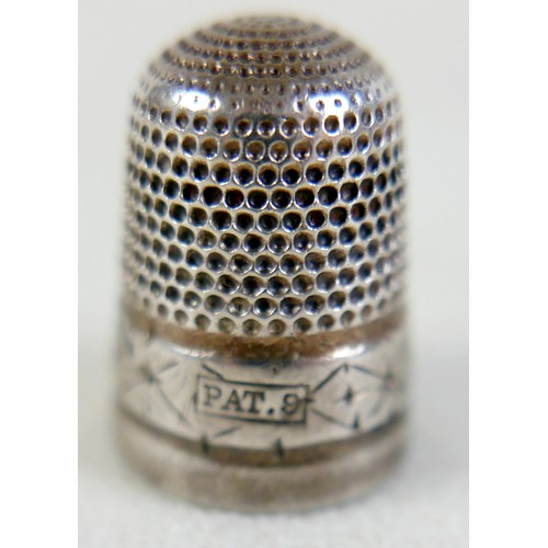 105 - An Edward VII silver pin cushion, in the form of a pig, Birmingham 1903, 5cm long, together with a s... 