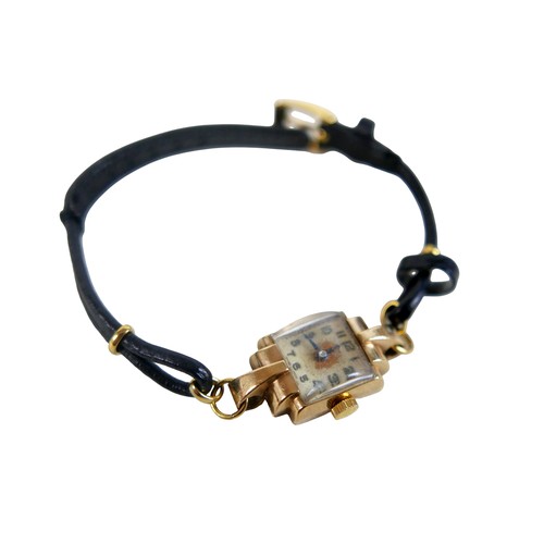29 - A gold cased art deco style ladies wrist watch with black leather strap, unmarked nut testing as 9ct... 