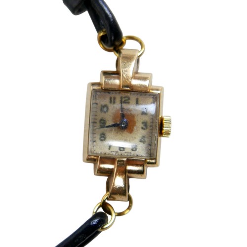 29 - A gold cased art deco style ladies wrist watch with black leather strap, unmarked nut testing as 9ct... 
