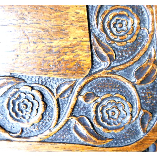 397 - The Burghley Chair: a Victorian heavily carved oak Armorial hall chair, dated 1866, profusely carved... 