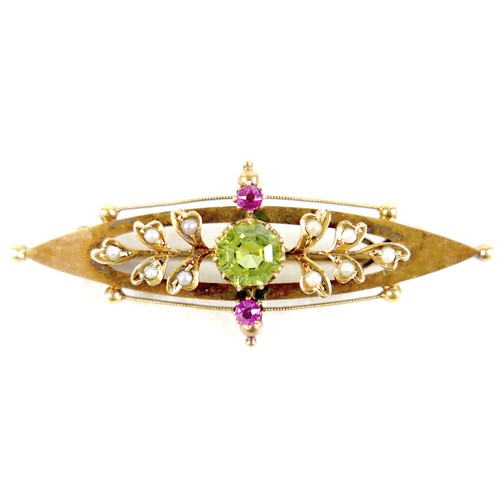36 - A Victorian 15ct gold brooch, marquise shape, set with a green peridot and two rubies, seed pearls, ... 