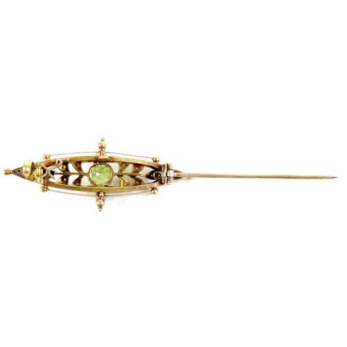 36 - A Victorian 15ct gold brooch, marquise shape, set with a green peridot and two rubies, seed pearls, ... 