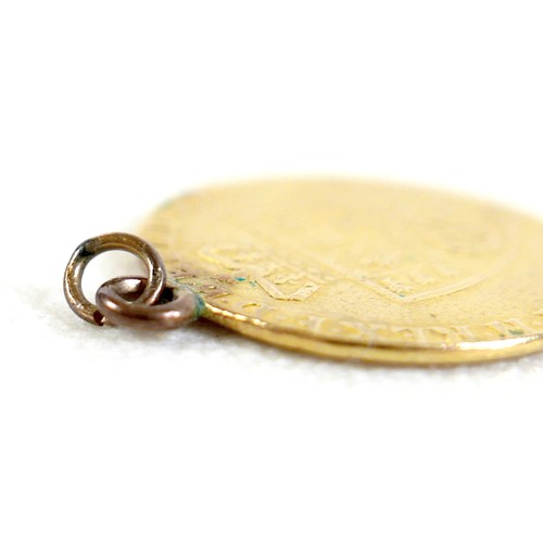 89 - A George III gold spade guinea, 1793, with ring attachment, 8.3g.
