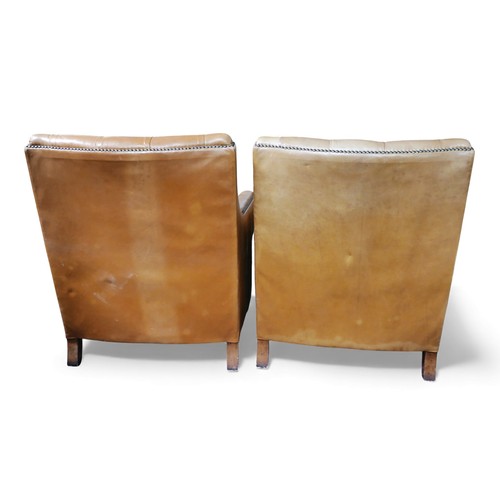 396 - A pair of Tetrad button back tan leather upholstered armchairs, both with fire labels, 74 by 82 by 8... 