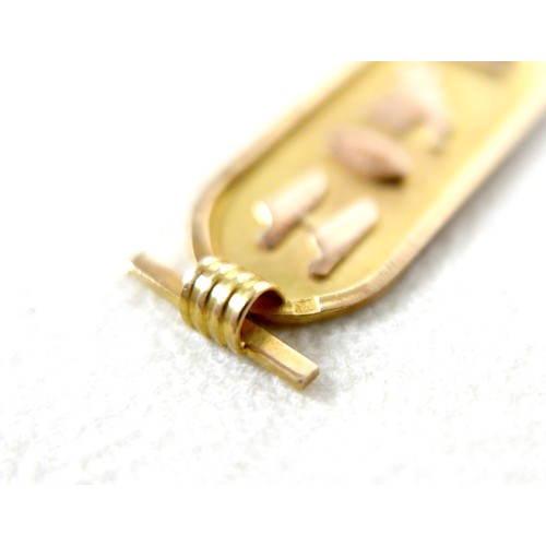 23 - An Egyptian 18ct gold cartouche pendant, 4cm long including loop, 2.2g.