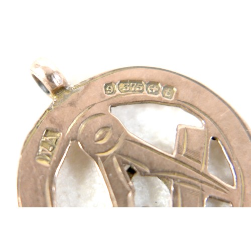 5 - A 9ct gold Masonic medallion, 2.3g,  together with a white metal pendant. (1 bag)