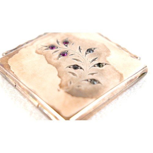 14 - A ruby-set gilt metal locket, 3cm square, marked '9ct gold back & front' and stamped 'silver setting... 